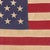 This vintage American flag is made from a cotton cloth with fully sewn stars and stripes. Please note staining,...