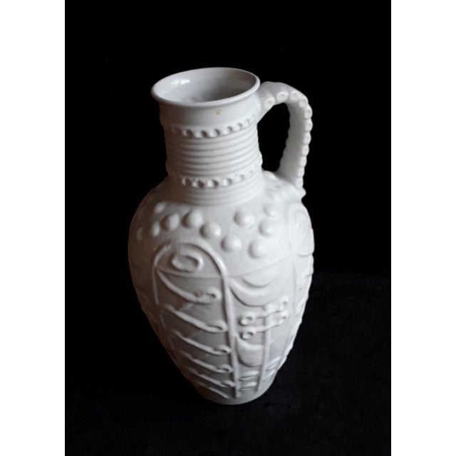 Vintage German Vase with Handle with Floral Relief Decor in White from Bay-Keramik, 1970s, in Very Good conditions....