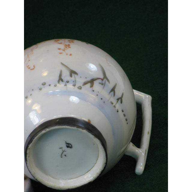 The Satsuma Teapot is a beautifully hand-painted piece from the Japanese Meiji Period, dating back to 1850-1899. Made of...