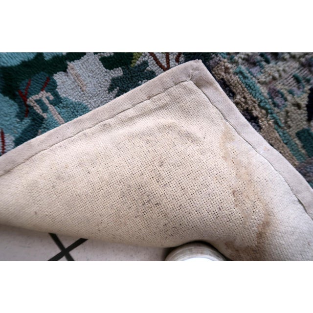 Handmade vintage American Hooked rug in pictorial design. The rug is from the middle of 20th century. It has some old...