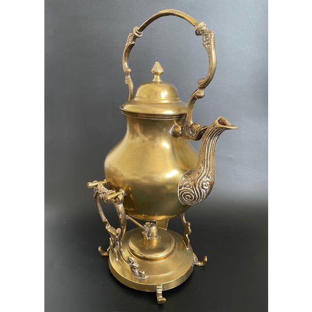 This ornate teapot is crafted from heavy brass with a tin-lined interior for practical use. Designed to tilt for easy...