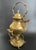 This ornate teapot is crafted from heavy brass with a tin-lined interior for practical use. Designed to tilt for easy...
