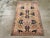 This mid-20th century Turkish Anatolian rug, measuring 3' 0" x 4' 11", showcases a dynamic geometric medallion design with...