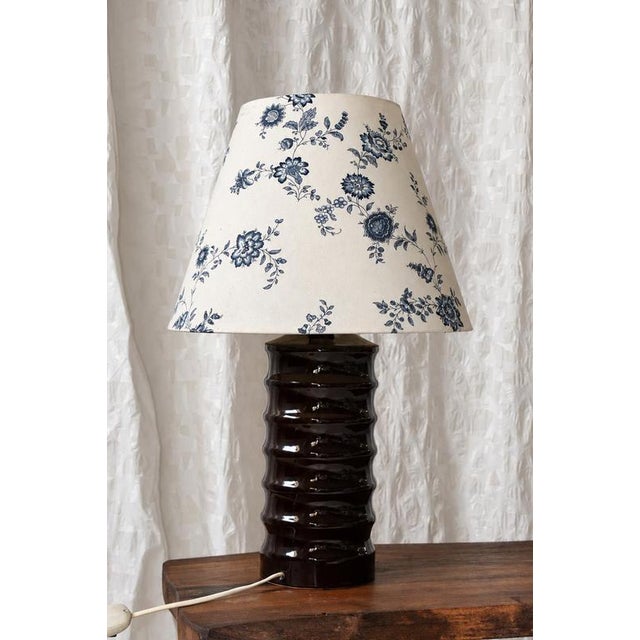 A distinctive hungarian sculptural ceramic table lamp, most likely dating from the 1970s. The tall ceramic body is...