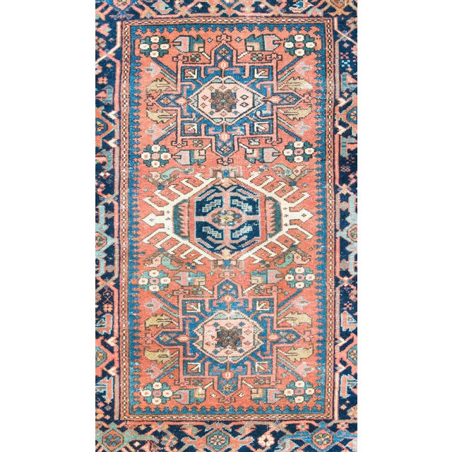 This early 20th-century Persian Heriz rug is a powerful example of the bold, geometric style for which the region is...