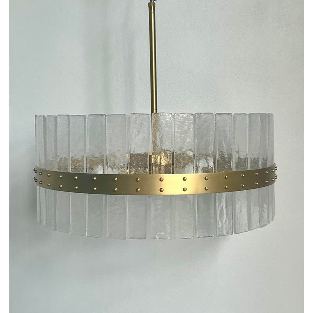 This stunning Sinclair four-arm chandelier is a masterful example of Mid-Century Modern lighting design, blending...