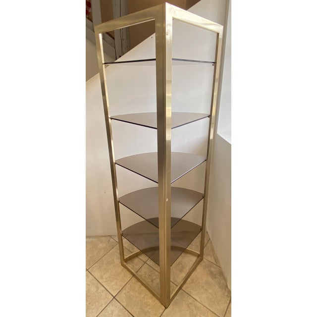 Perfectly stable bookcase Gold-tone metal tube frame in very good condition with minimal signs of wear 5 smoked glass...