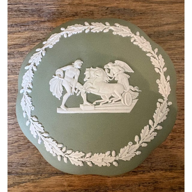 Beautiful Wedgwood Jasperware scalloped lidded box in matte Sage green. The scene on the lid is surrounded by a white...