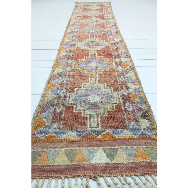 This Long carpet runner from easthern of turkey nomads weaving. Beautiful pastel burnt amber colored rug has got purple...