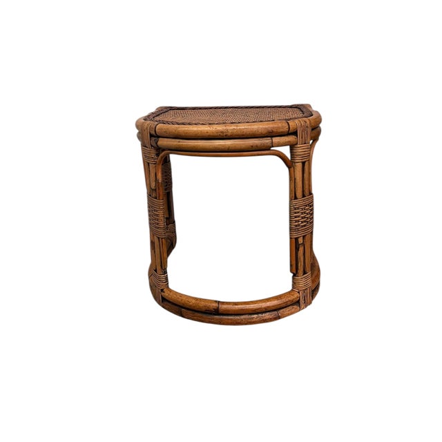 This vintage table features a sculptural rattan and bamboo construction with a distinctive demi-lune (half-round)...