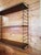 String wall-mounted bookcase by Nils Strinning for String Design AB. Two iron sides and three shelves. Extremely...