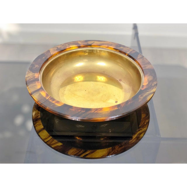 Centerpiece plate in faux tortoiseshell acrylic and brass interior, Italy, circa 1960.