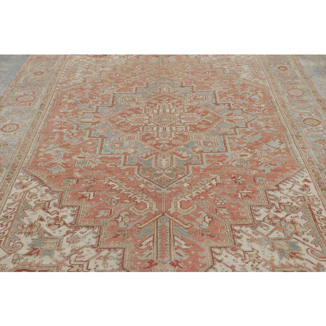 Hand-knotted in wool, circa 1920–1940, this 8x11 antique Heriz rug is a distinguished example of one of the most iconic...