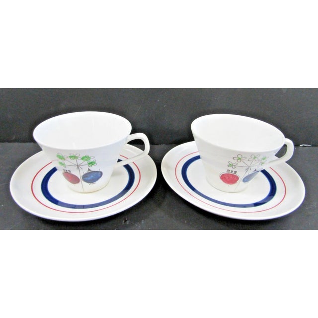 The Rörstrand Sweden Pomona Picknick Set of Two Cups and Saucers, designed by Marianne Westman, is a vintage ceramic cup...
