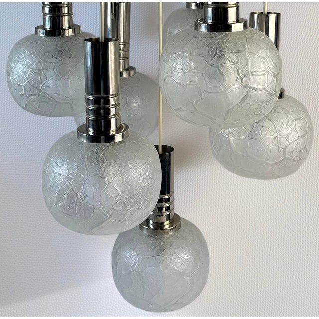 Vintage Doria Leuchten chandelier from the 1970s featuring seven hand-blown crackled glass globes with chrome holders....