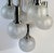 Vintage Doria Leuchten chandelier from the 1970s featuring seven hand-blown crackled glass globes with chrome holders....