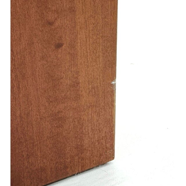 A stunning pair of vintage Italian nightstands from the 1970s, featuring a Midcentury Modern design that combines warm,...
