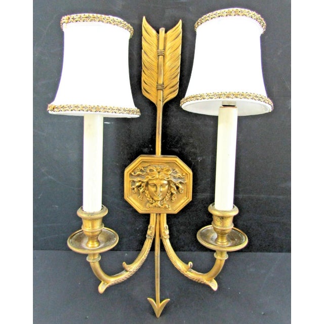 The French Empire Wall Sconces are a pair of medium-sized antique original fixtures from the late 19th century. Made of...