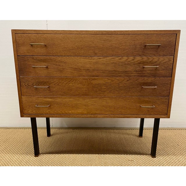 Highly desirable Hans Wegner styled oak chest with four drawers supported by steel legs. Circa, 1955.