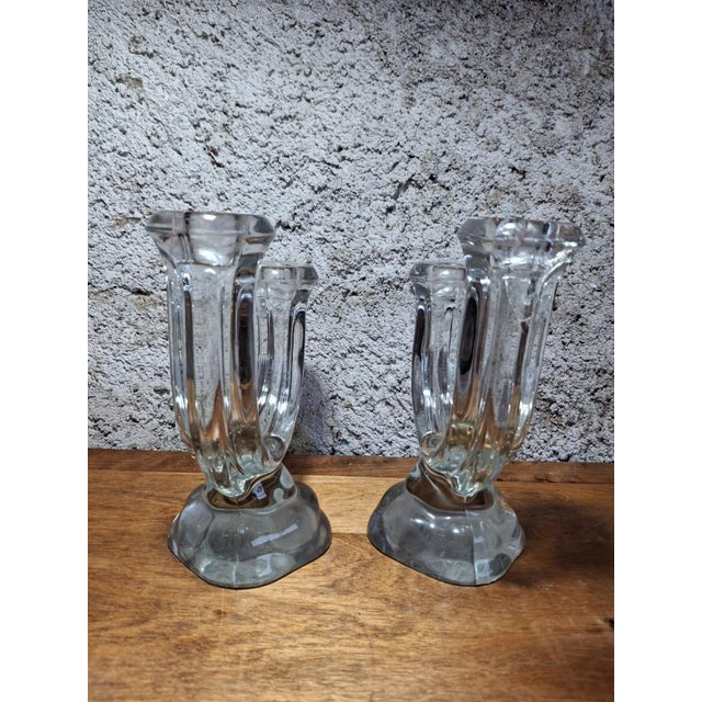A beautiful pair of double candlesticks in molded pressed glass, dating from the 1930s-1940s. Each piece has a u-shape...