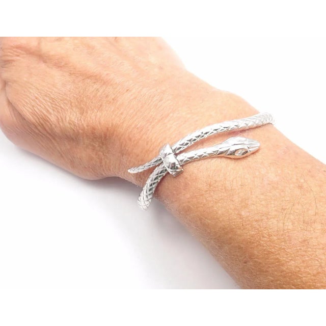 Metal: 18k white gold Fits: 6.5" Wrist Width: 15mm Weight 32.3 grams Stones: 2 round brilliant cut diamonds VVS1 clarity,...