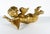 An antique wood carved gold gilt flying winged Putti. Putti is in the flying position. Measures 10” long, 3 ½” high and 6...