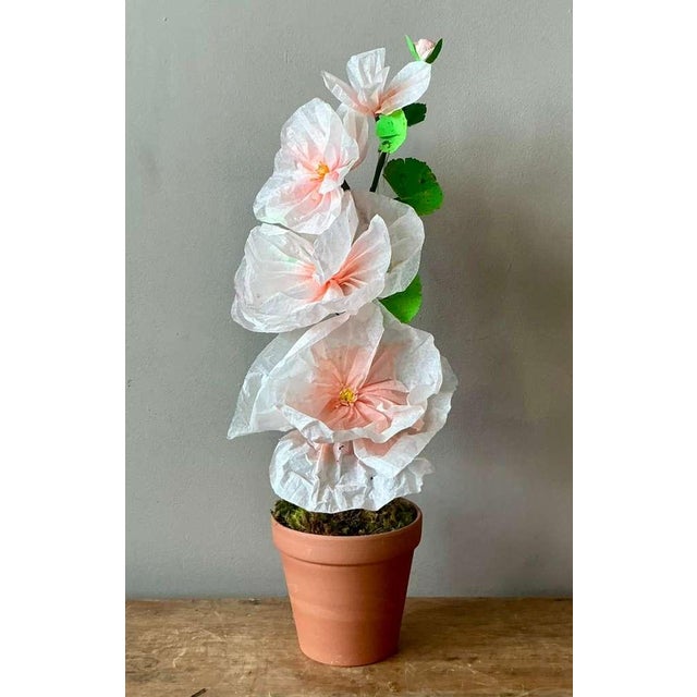 Contemporary hand-rolled paper flowers are a modern, artistic take on traditional floral arrangements. These flowers are...