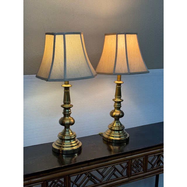 Design Plus Gallery presents a Pair of Cast Brass Table Lamps by Stiffel from the Mid 20th Century. They have a...