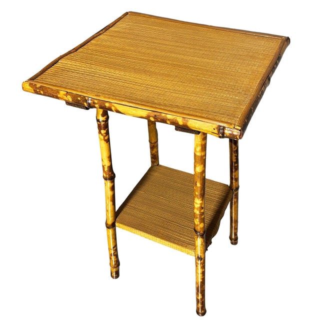 Late Victorian tiger bamboo side table with intricate embossed Paisley block pattern octagonal tabletop. The table...