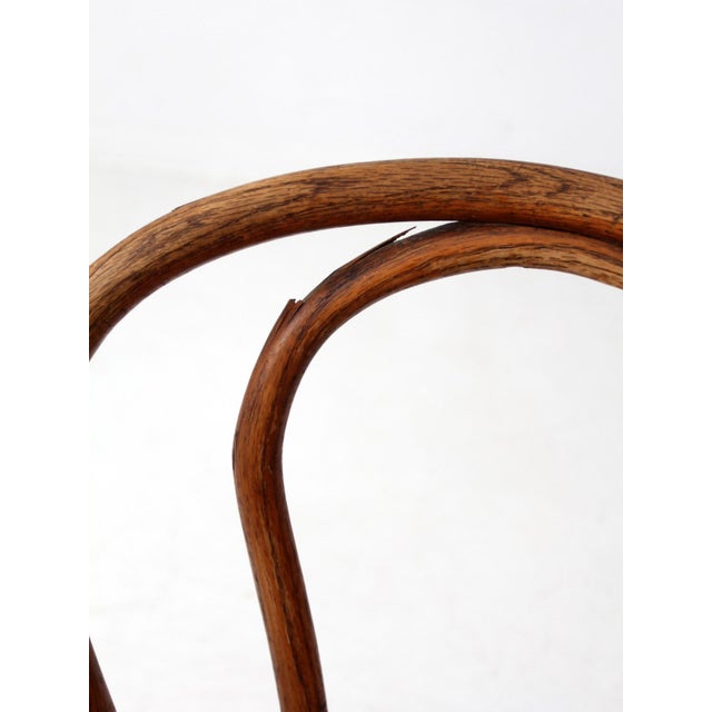 This is an antique bentwood chair made by Herhold Chair Co. of Chicago, dating to the late 19th or early 20th century....