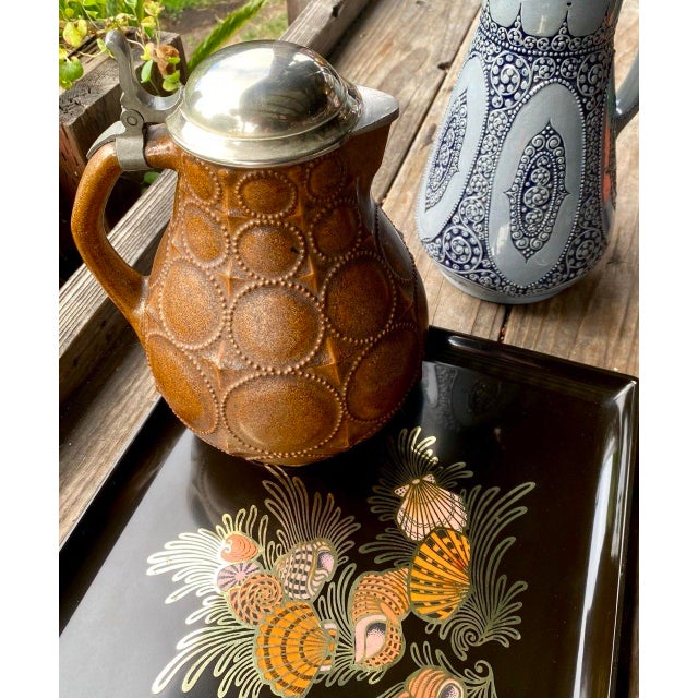 An exceptional early 20th-century German stoneware pitcher designed by Paul Wynand in 1910 and executed by the celebrated...