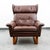 Chocolate brown wingback lounge chair on oak sled style base. Classic and timeless look. Imported directly from Denmark in...