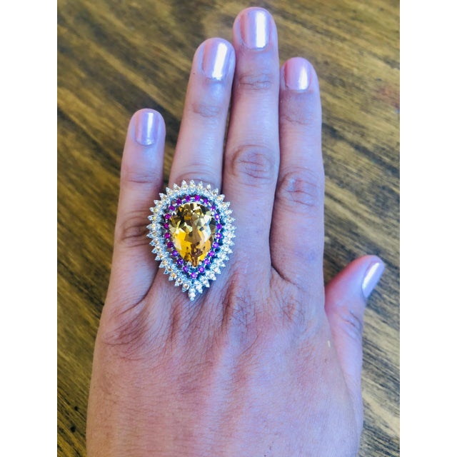 This ring has a natural Pear Cut Citrine that weighs 11.42 carats. The Citrine measures at 19 mm x 14 mm and has a...