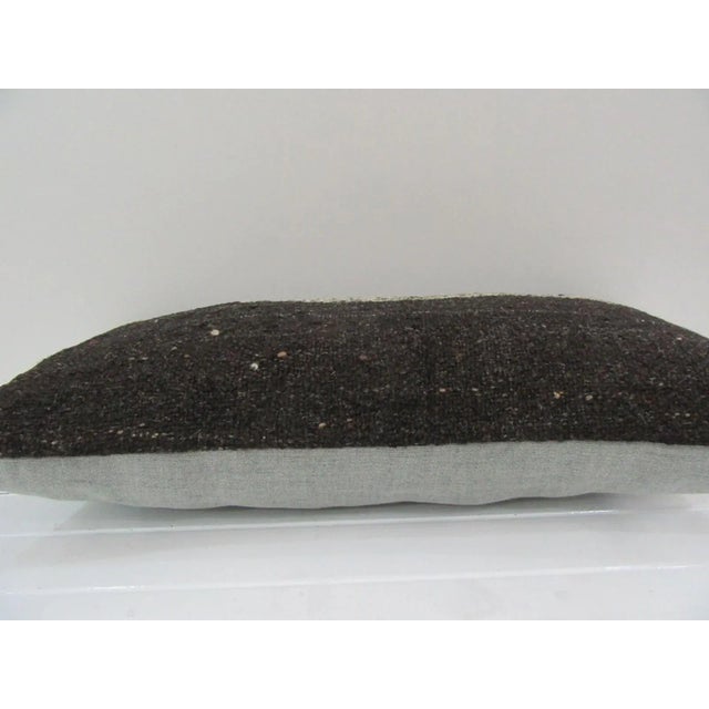 This is a pillow cover made from a vintage kilim rug. The piece was properly washed and ready to use. Pillow inserts not...