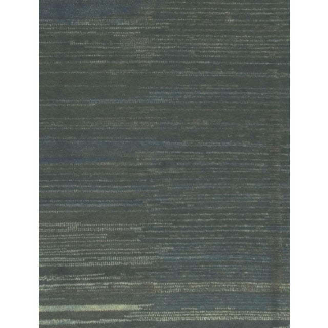 Gabbeh with a plain center field with abrash (color change) that creates an almost sea-like feel. Thick pile and hard-...