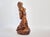 Elegant vintage ceramic sculpture of a woman, handcrafted with a smooth, glossy finish. The unknown artist captures...