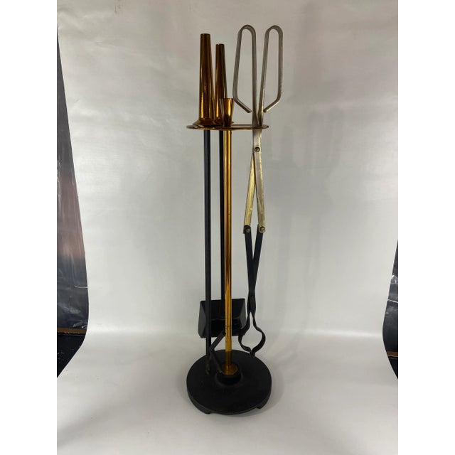 Mid century modern three piece fireplace tool set. Shovel, poker, and tong / log grabber with conical handles. Black iron...