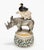 Lidded Container with Triple Handle of Rhino, Bear, and Duck transforms a simple porcelain vessel into a playful...