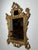 Beautiful and highly decorative antique French mirror in richly carved giltwood. This piece features an elegant Rococo-...