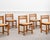 A beautiful set of six vintage chairs from Regain, crafted from solid elm with woven straw seats. Their understated and...