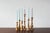 A set of six vintage wooden candleholders, whose varied, turned shapes create a cohesive and exceptionally decorative...