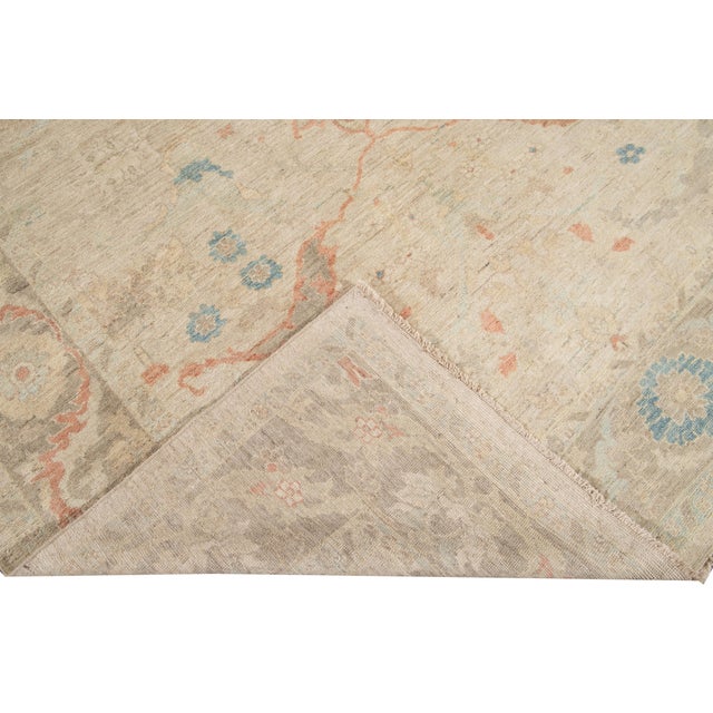 Beautiful modern Sultanabad hand knotted wool rug with a purple field. This Sultanabad rug has a gray frame and multi-...
