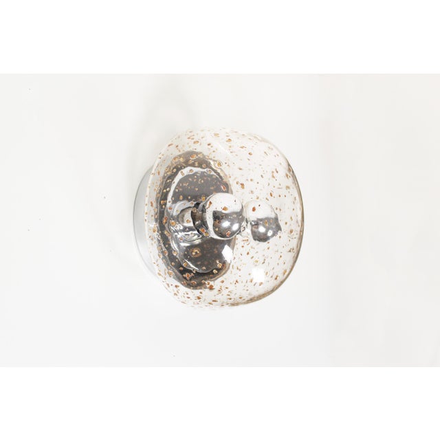 Stunning ‘dome’ wall lamp by Doria Leuchten. Polished metal framing holding a glass shade. In excellent condition without...