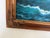 A striking large-scale oil painting on canvas depicting a powerful sailing vessel advancing through rolling ocean waves...