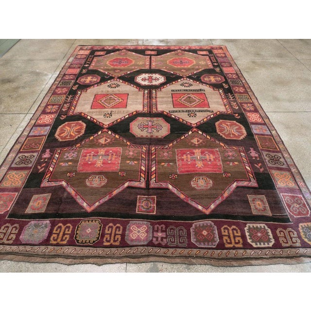 A vintage Turkish Anatolian tribal room size carpet handmade during the Mid-20th Century. Measures: 9' 11" x 14' 3".