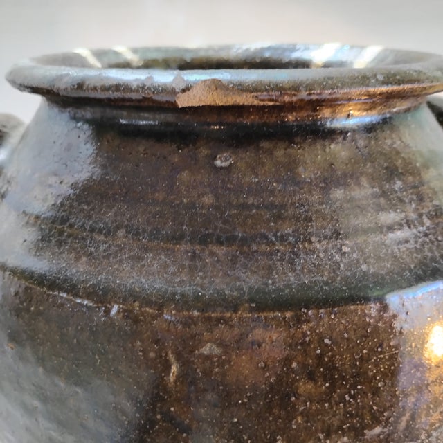 That is a beautiful two-gallon alkaline-glazed Southern stoneware jar from the historic Catawba Valley Pottery region of...
