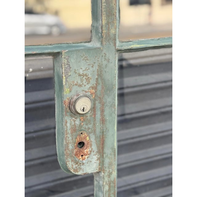 A museum-quality piece of Hollywood Regency history, this stunning pair of metal French doors was custom-made for the...