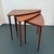 This set of three Scandinavian Modern teak nesting tables were manufactured by Selig circa the 1960s. The tables feature a...