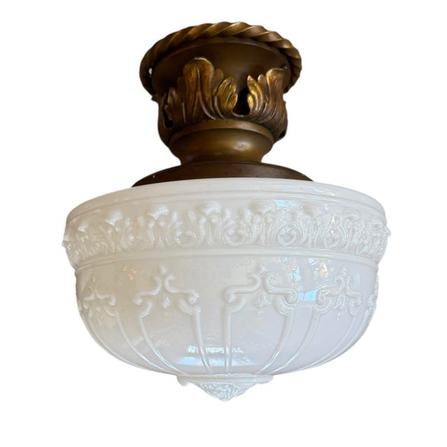 The details on this light fixture are stunning. All original brass patina with roping and acanthus designs. Perfect for...