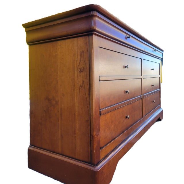 Beautifully crafted by Grange Furniture, this Louis Philippe–style dresser is made of solid cherry and showcases the...